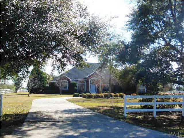 1621 West 9 & Half Mile Road Cantonment, FL 32533 - Photo 1 of 25 Wonderfully secluded down a long drive and rail fencing