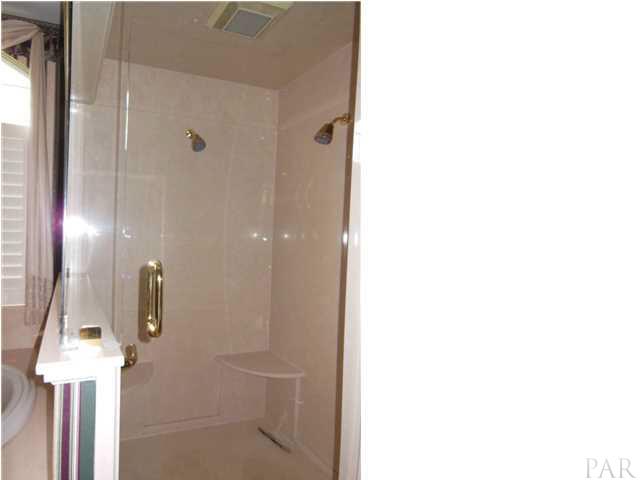 1621 West 9 & Half Mile Road Cantonment, FL 32533 - Photo 14 of 25 A large walk in shower with corner seating