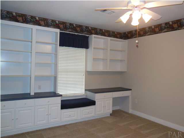1621 West 9 & Half Mile Road Cantonment, FL 32533 - Photo 18 of 25 A guest bedroom with built-in storage