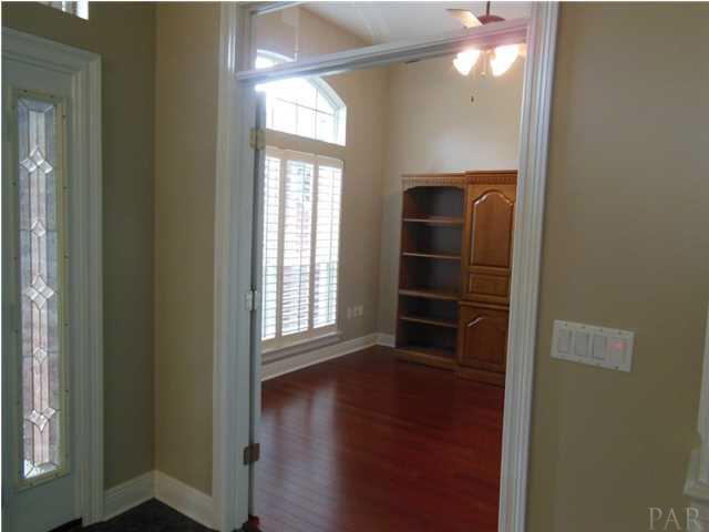 1621 West 9 & Half Mile Road Cantonment, FL 32533 - Photo 5 of 25 The office is located off of the front foyer and includes shelving and storage cabinets and a closet