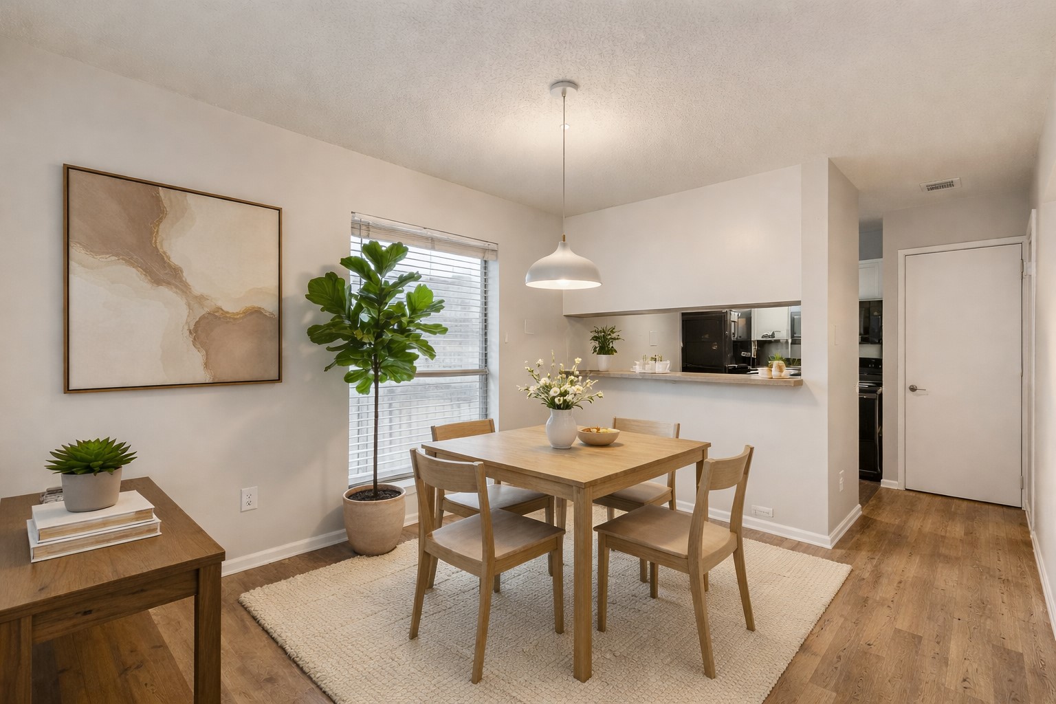 3115 Helms Street, Unit 210 Austin, TX 78705 - Photo 3 of 17 a view of a dining room with furniture and wooden floor