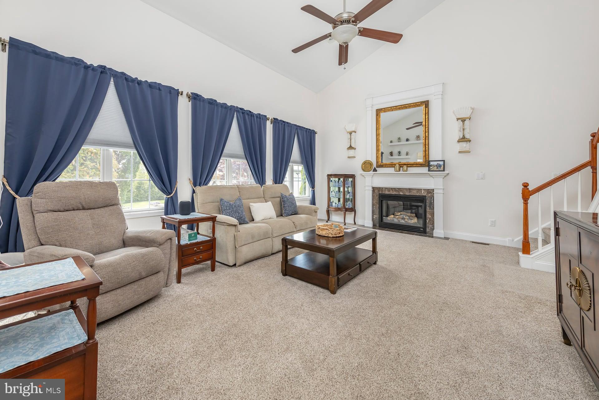 144 Point Airy Road Pilesgrove, NJ 08098 - Photo 15 of 65 a living room with furniture a fireplace and a window