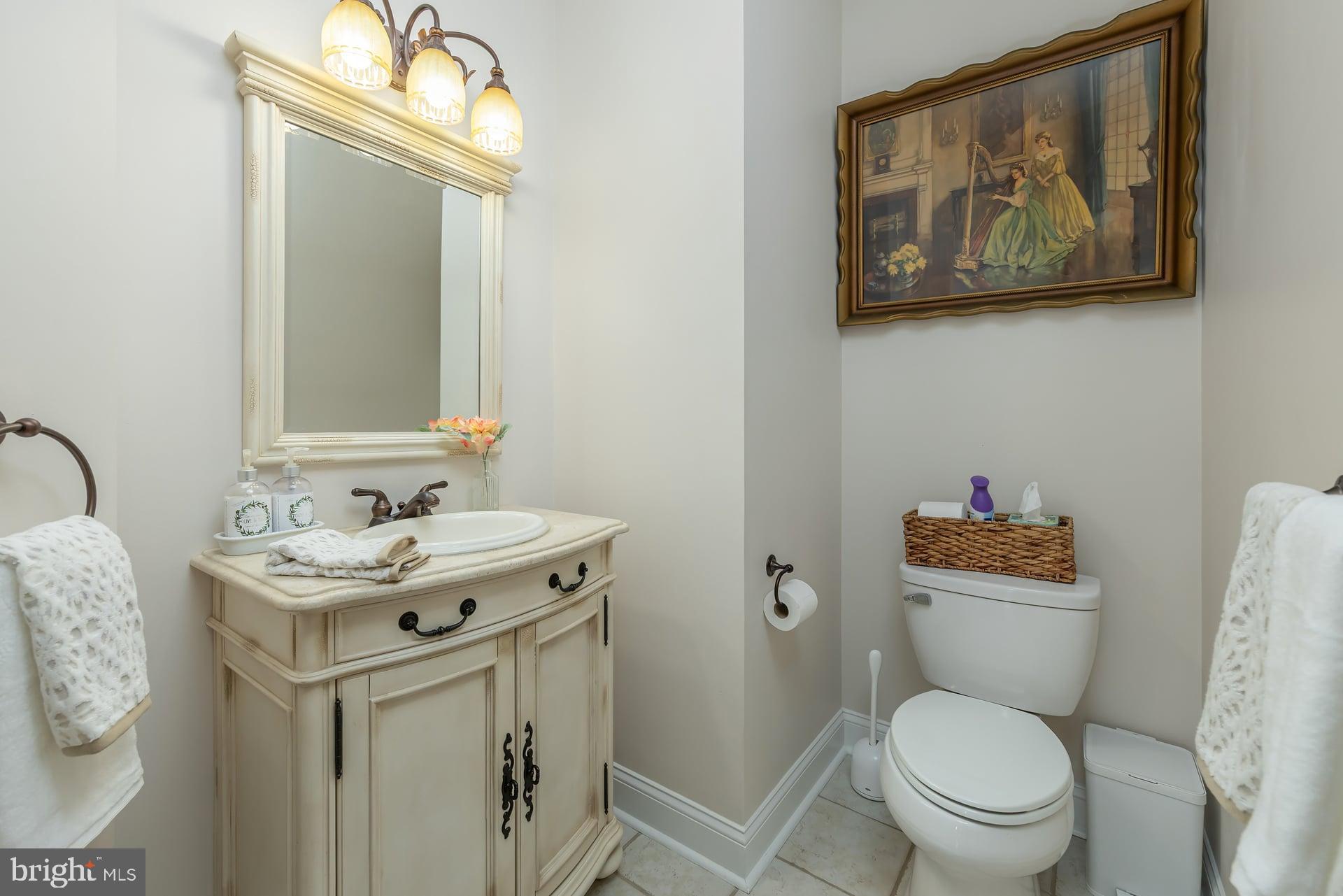 144 Point Airy Road Pilesgrove, NJ 08098 - Photo 18 of 65 a bathroom with a toilet a sink and a mirror