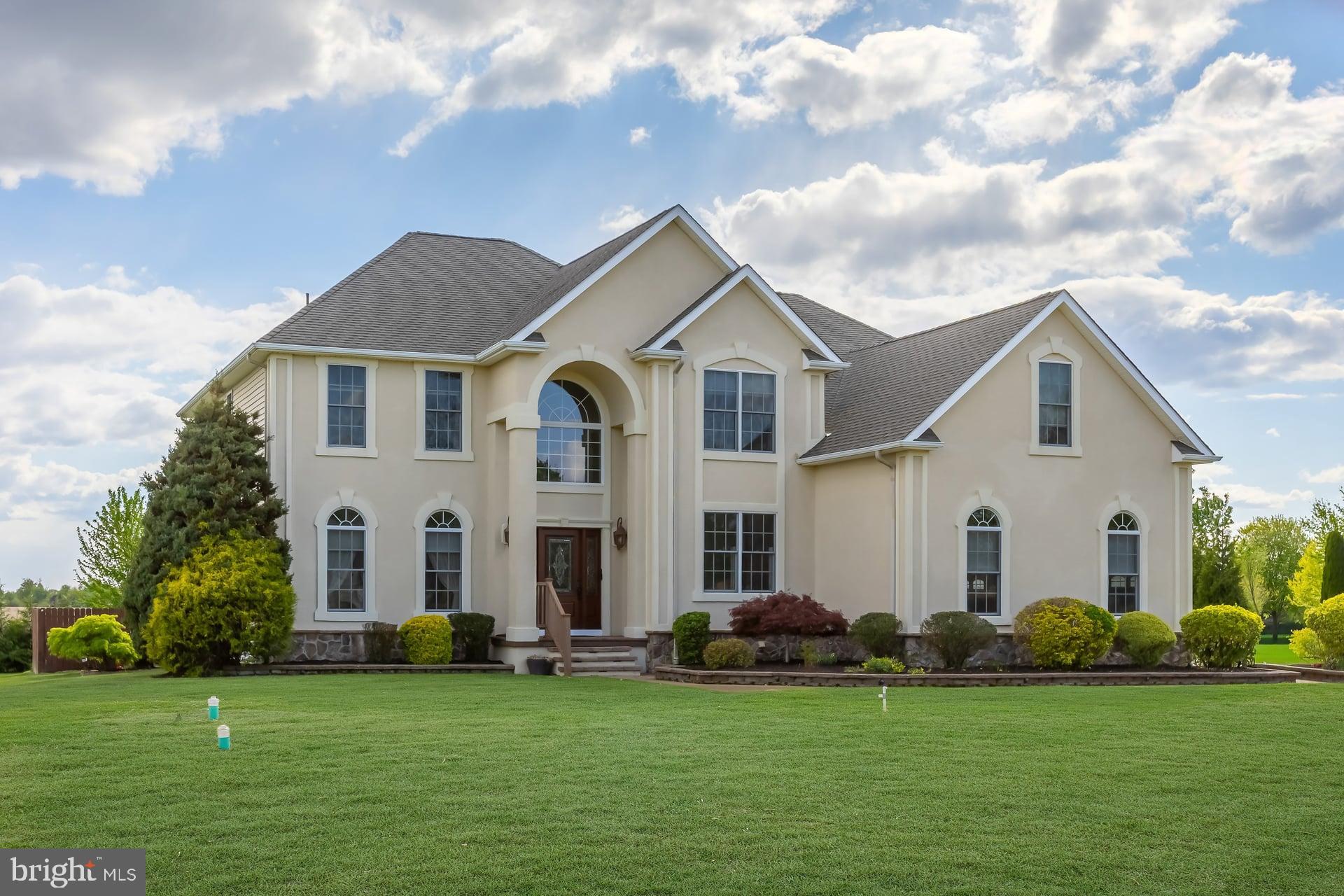 144 Point Airy Road Pilesgrove, NJ 08098 - Photo 2 of 65 a view of a white house with a big yard and large trees