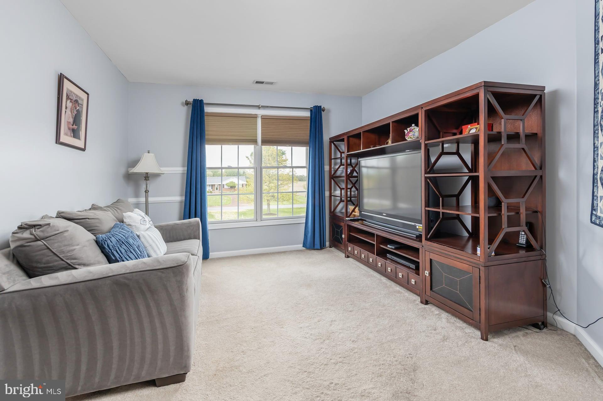 144 Point Airy Road Pilesgrove, NJ 08098 - Photo 23 of 65 a living room with furniture and a flat screen tv