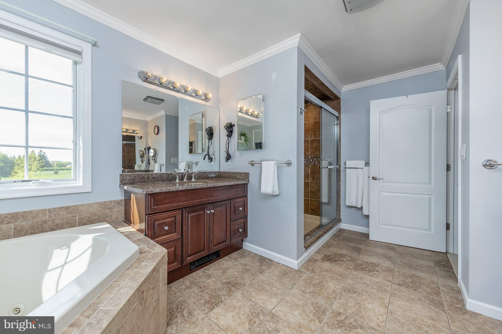 144 Point Airy Road Pilesgrove, NJ 08098 - Photo 26 of 65 a spacious bathroom with a tub sink and mirror
