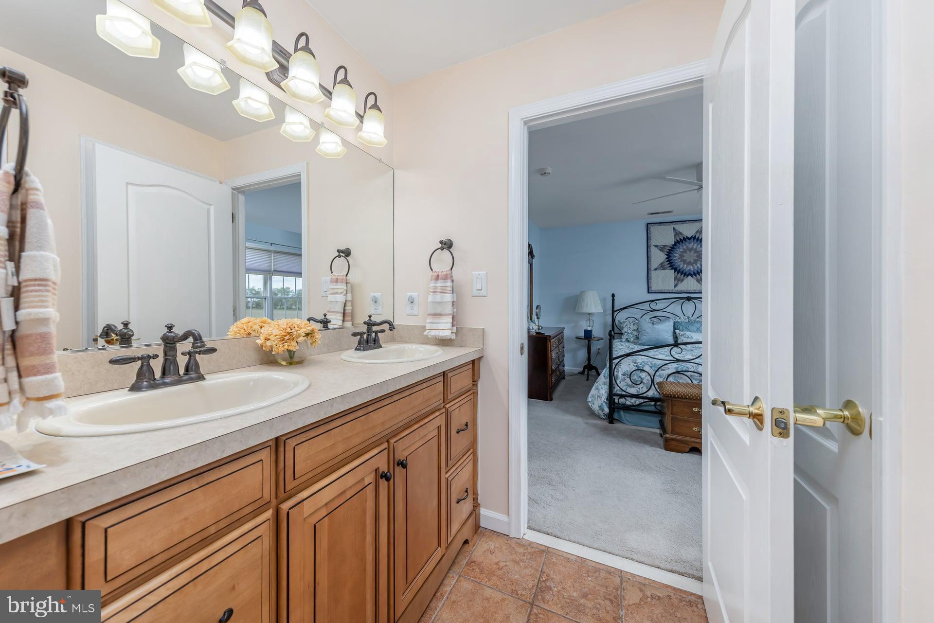 144 Point Airy Road Pilesgrove, NJ 08098 - Photo 29 of 65 a en suite bathroom with a double vanity sink mirror and