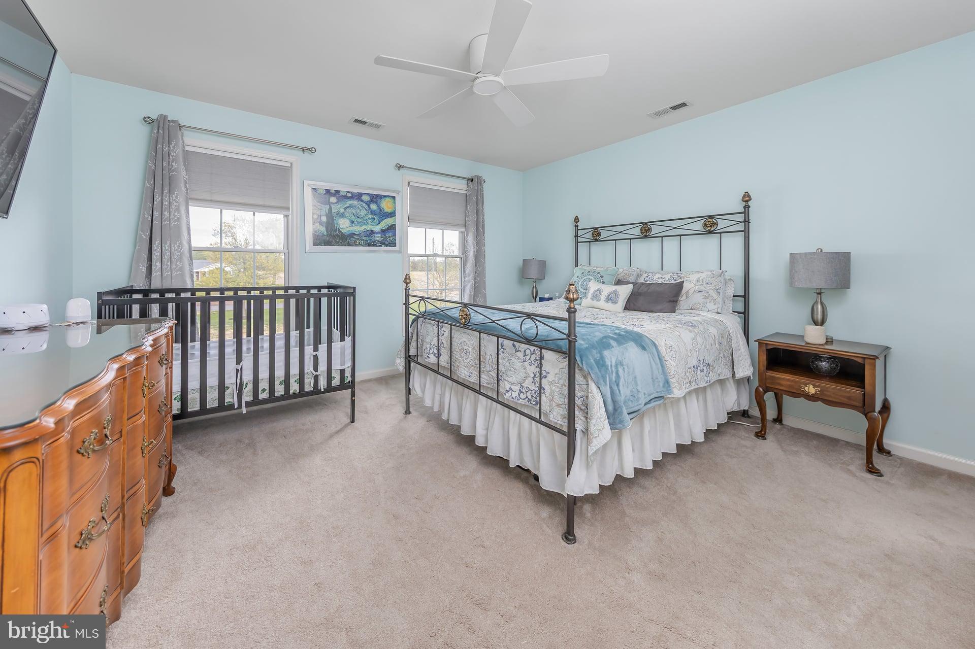 144 Point Airy Road Pilesgrove, NJ 08098 - Photo 32 of 65 a bed sitting in a bedroom next to a window