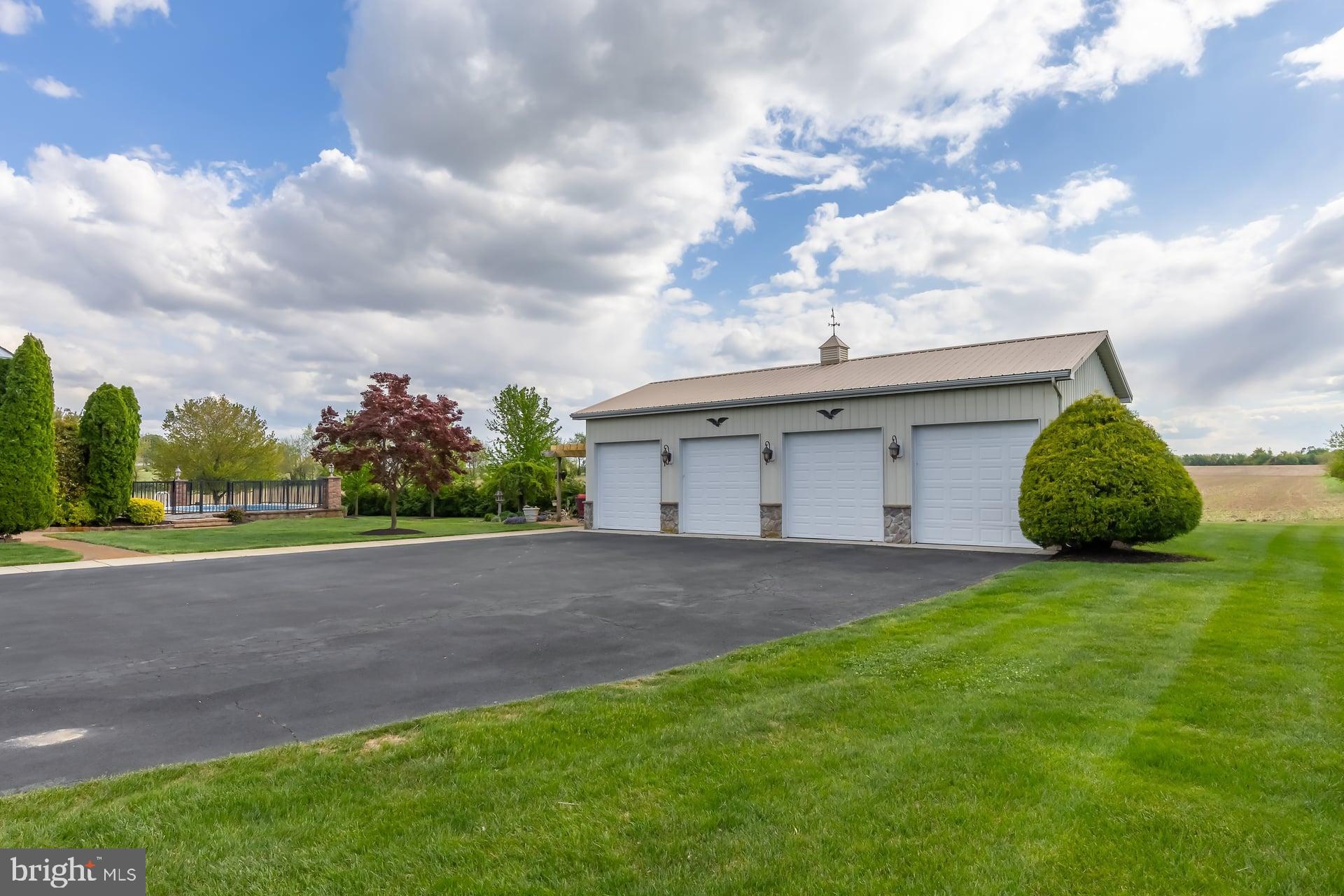 144 Point Airy Road Pilesgrove, NJ 08098 - Photo 45 of 65 a view of a house with a yard and garage