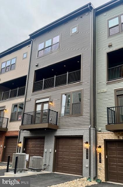 21791 Express Terrace Ashburn, VA 20147 - Photo 4 of 7 a front view of a building with a street