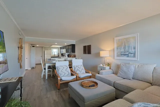 a bedroom with a large bed and a large window