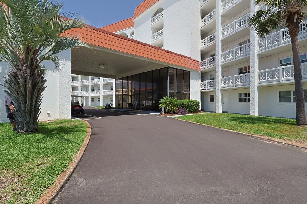 909 Santa Rosa Boulevard, Unit 528 Fort Walton Beach, FL 32548 - Photo 30 of 66 a view of a building with a yard