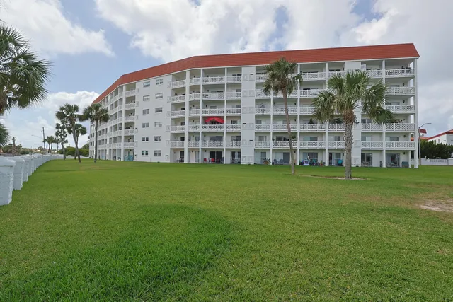 a kitchen with kitchen island a sink stove and refrigerator