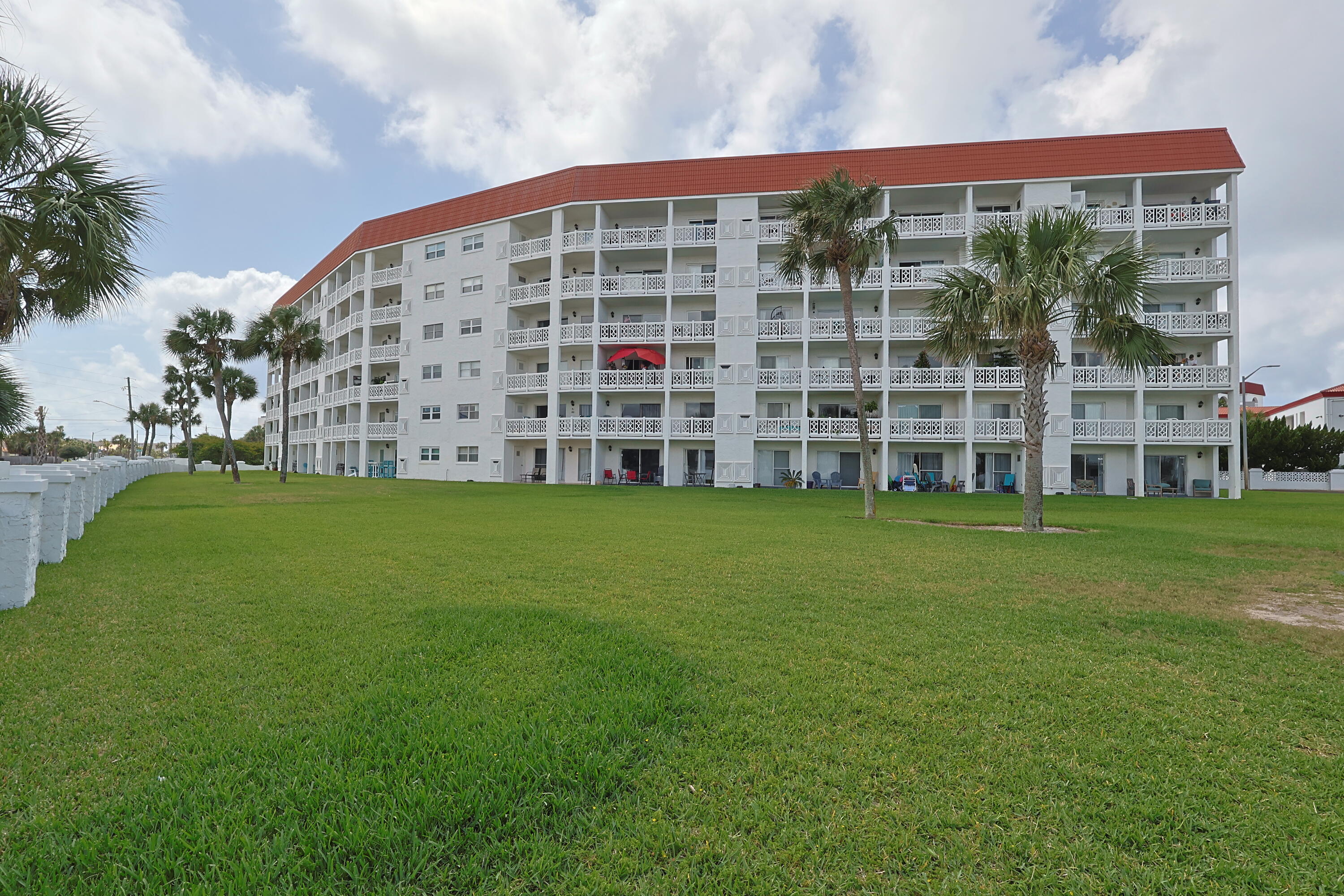 909 Santa Rosa Boulevard, Unit 528 Fort Walton Beach, FL 32548 - Photo 31 of 66 a view of a building with a yard