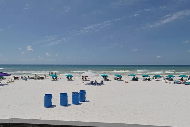 a view of a swimming pool kitchen from a balcony