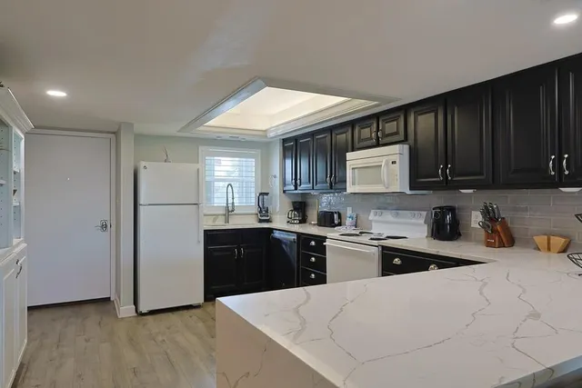 a view of kitchen dining table and chairs