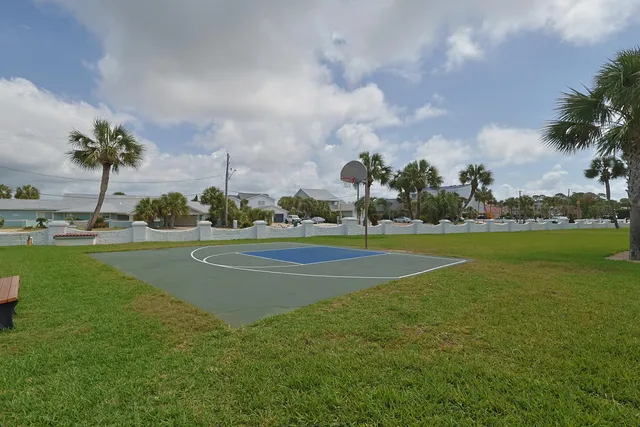 a view of a livingroom with wooden floor and furniture