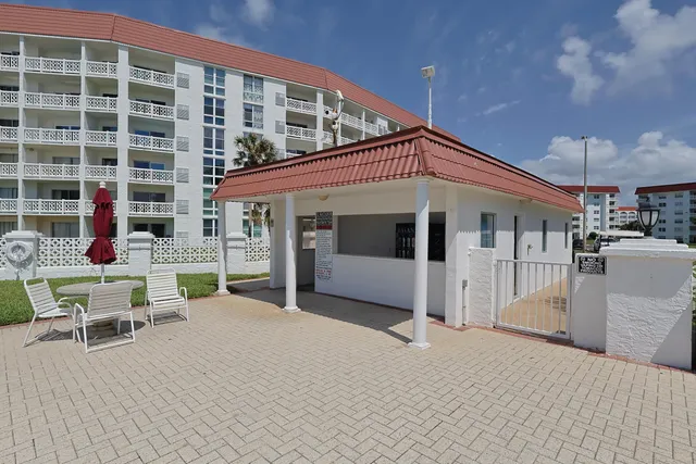 a view of a swimming pool and a yard