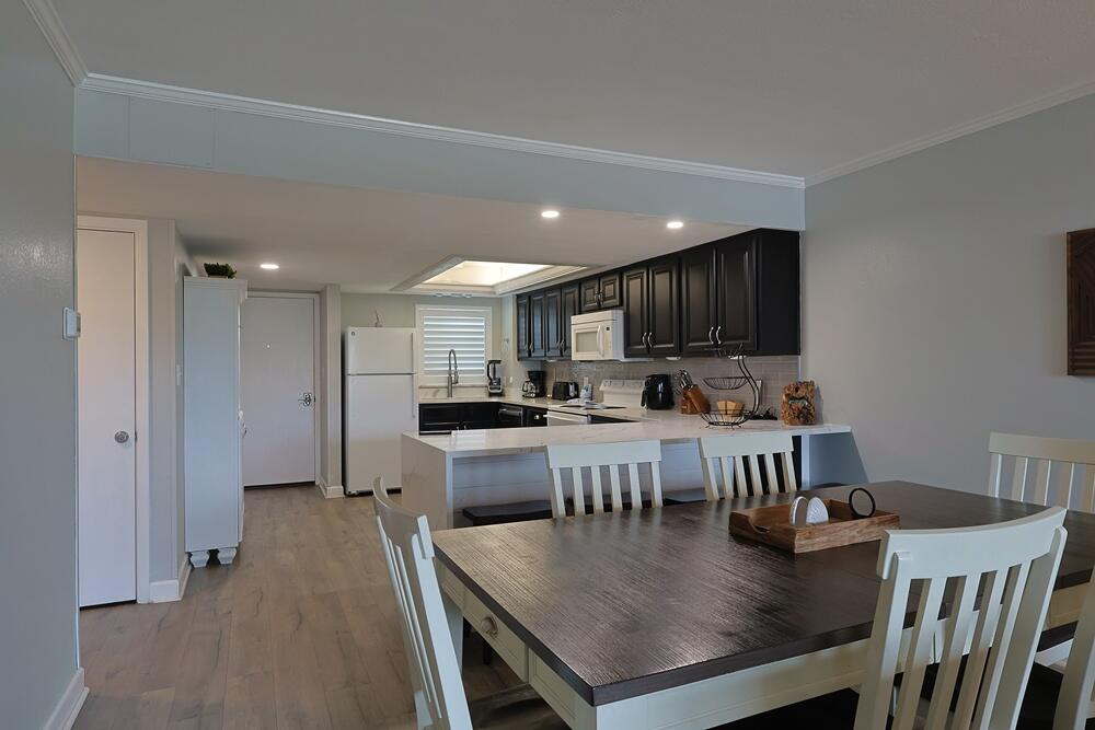 909 Santa Rosa Boulevard, Unit 528 Fort Walton Beach, FL 32548 - Photo 5 of 66 a view of kitchen dining table and chairs
