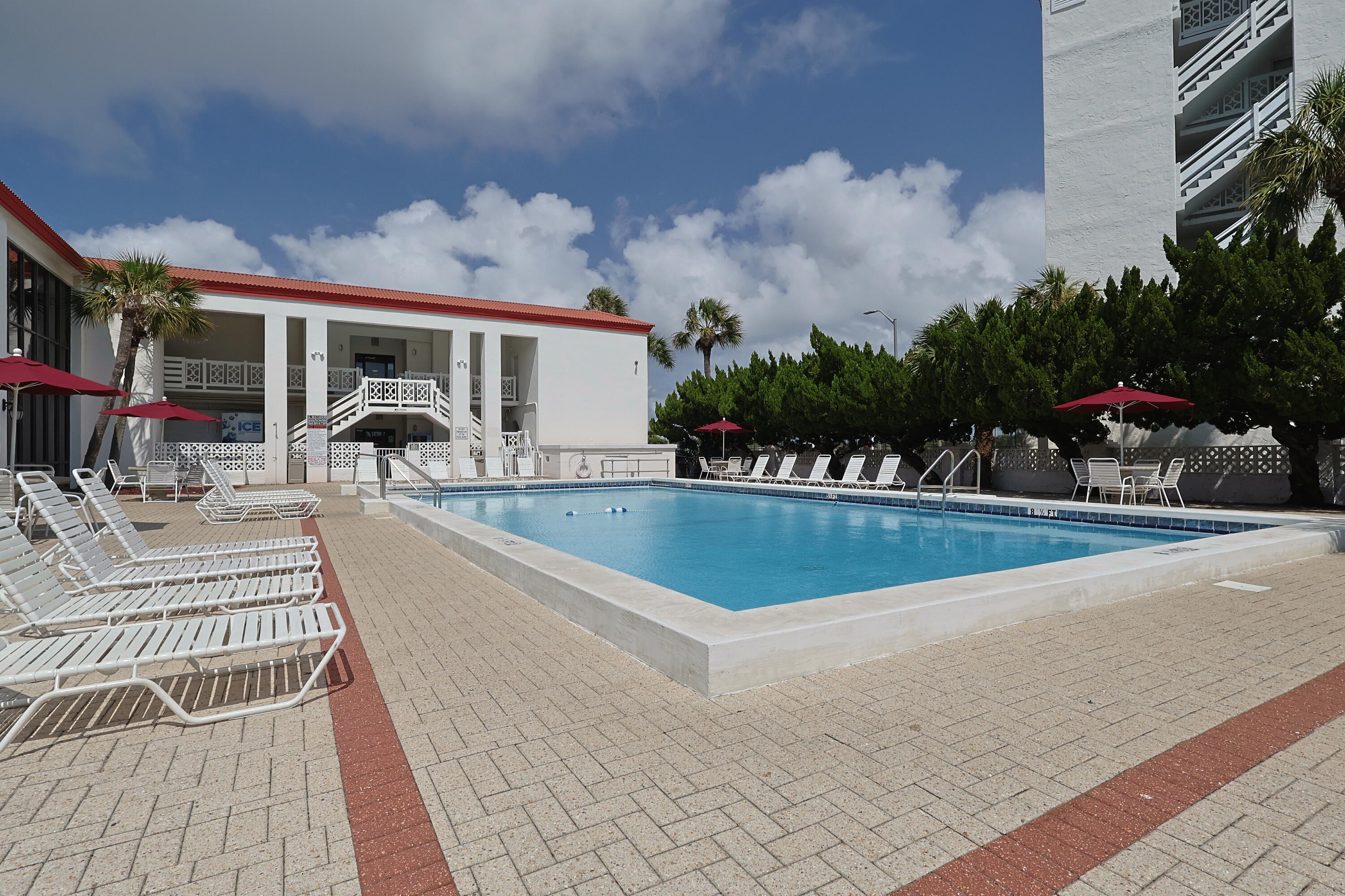 909 Santa Rosa Boulevard, Unit 528 Fort Walton Beach, FL 32548 - Photo 51 of 66 a view of a house with swimming pool and sitting area