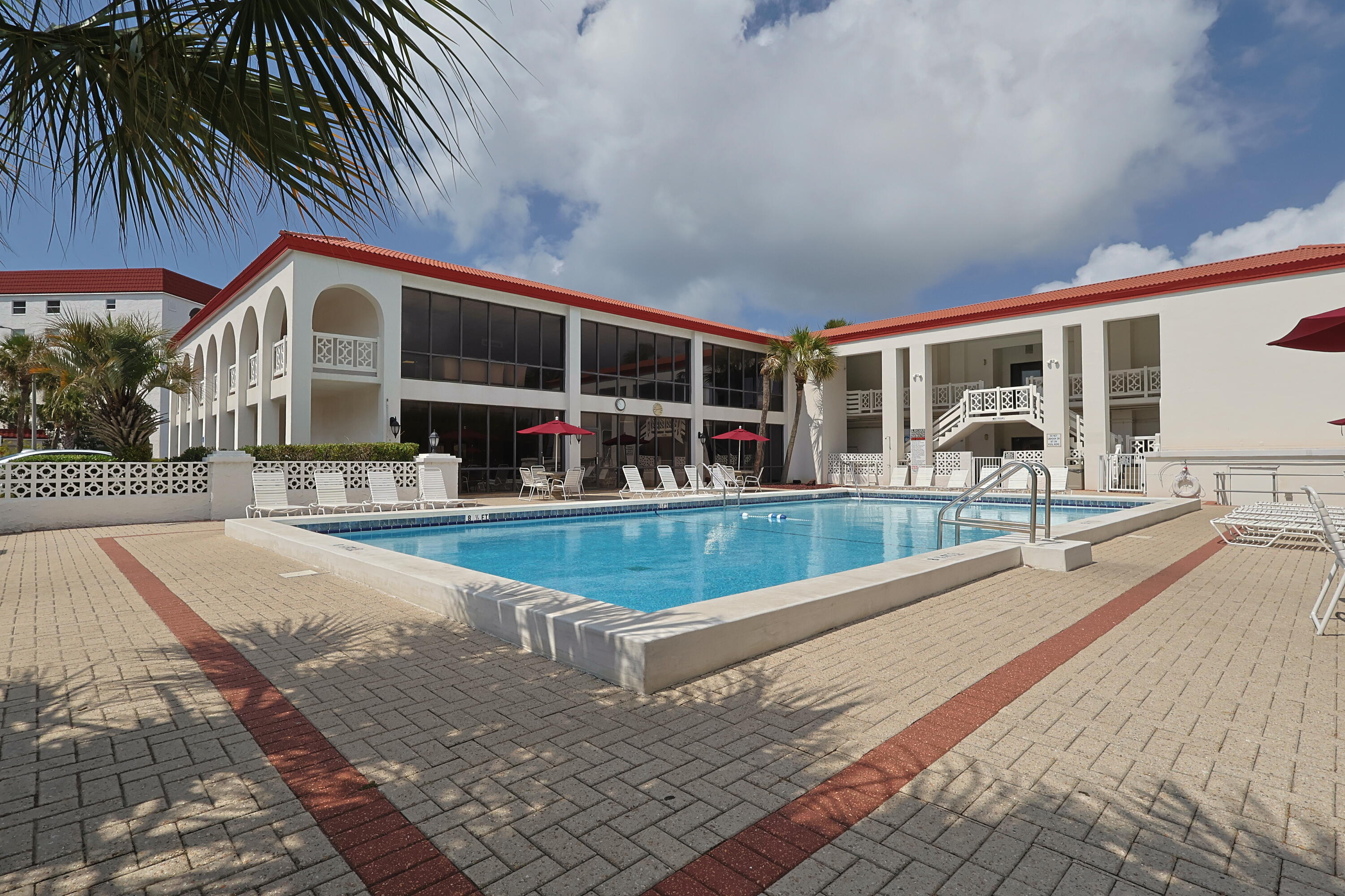 909 Santa Rosa Boulevard, Unit 528 Fort Walton Beach, FL 32548 - Photo 52 of 66 a view of a house with swimming pool and sitting area