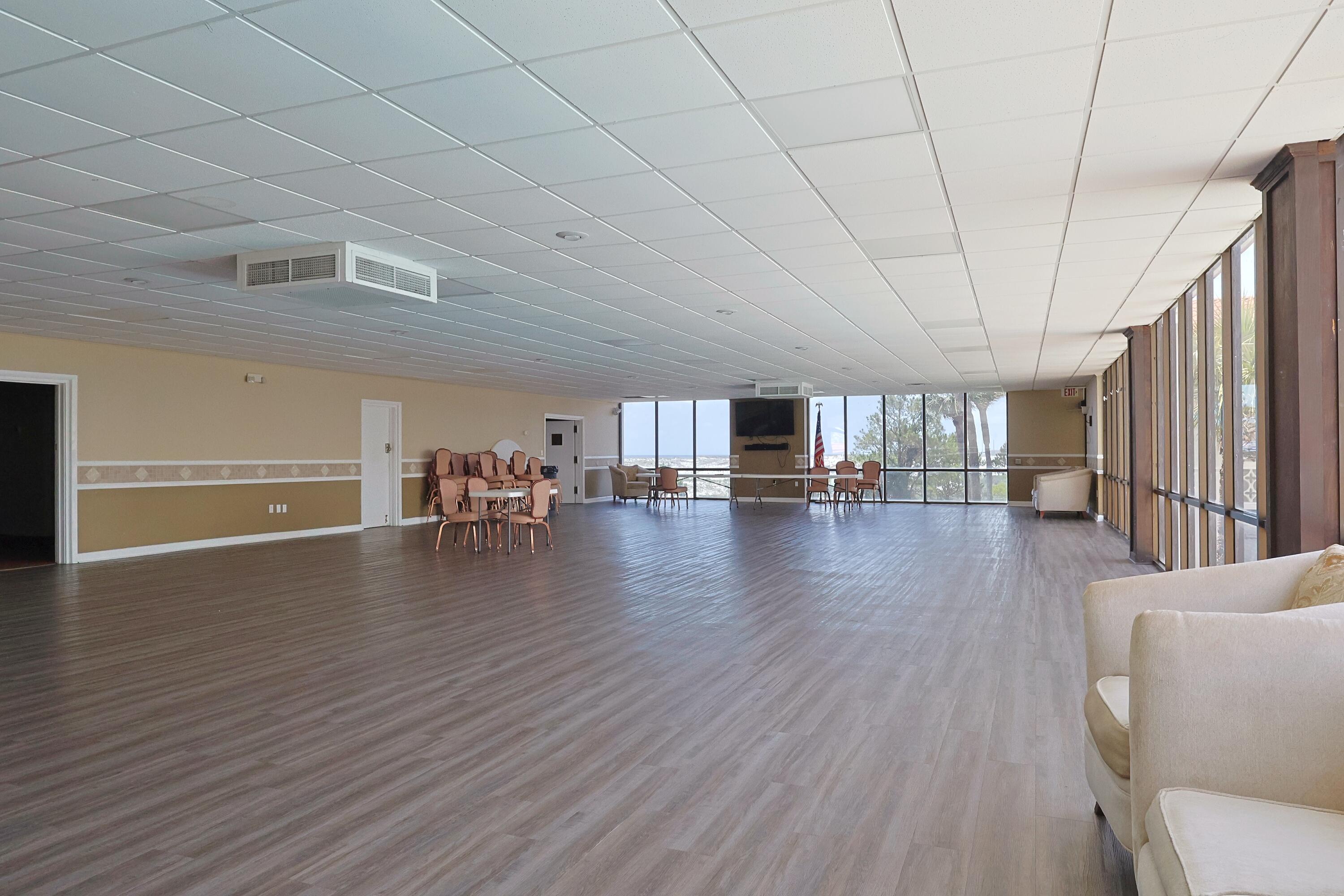 909 Santa Rosa Boulevard, Unit 528 Fort Walton Beach, FL 32548 - Photo 57 of 66 a view of a livingroom with wooden floor and furniture
