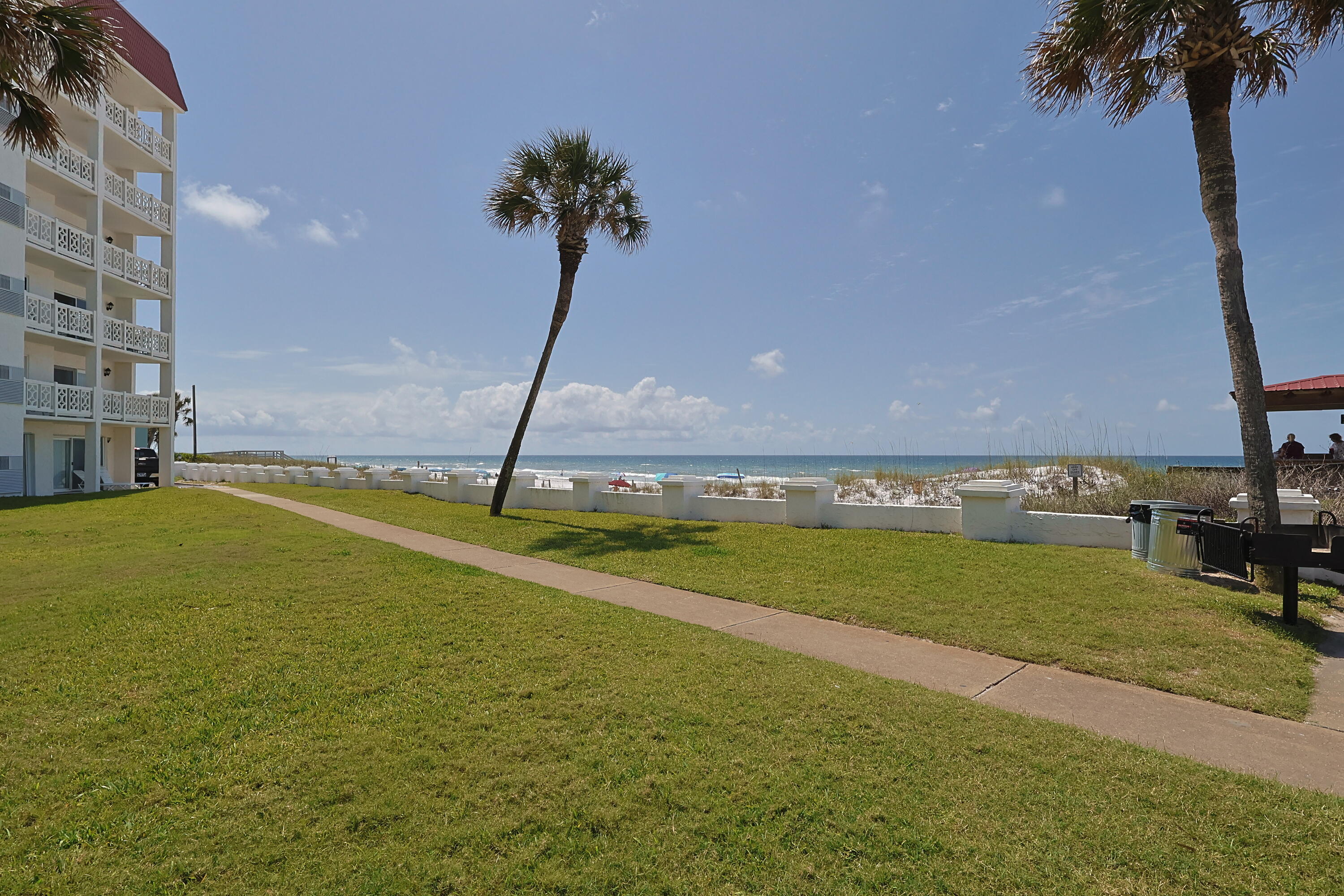 909 Santa Rosa Boulevard, Unit 528 Fort Walton Beach, FL 32548 - Photo 64 of 66 a view of a swimming pool and a yard