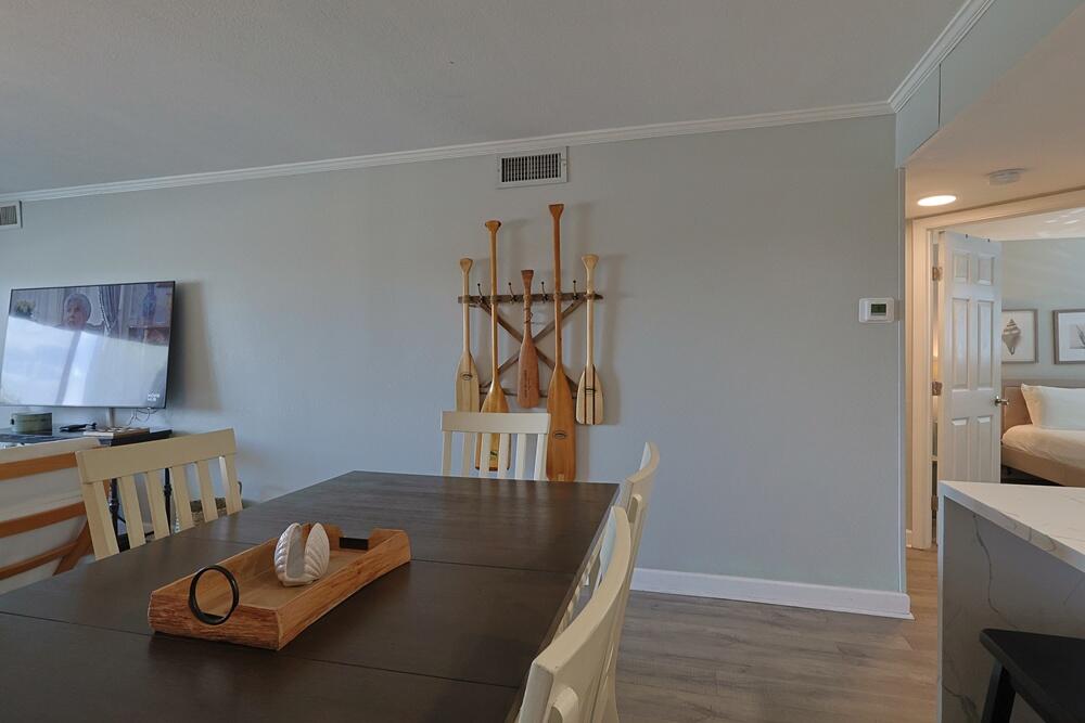 909 Santa Rosa Boulevard, Unit 528 Fort Walton Beach, FL 32548 - Photo 7 of 66 a living room with furniture and a flat screen tv