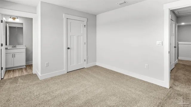 an empty room with closet area
