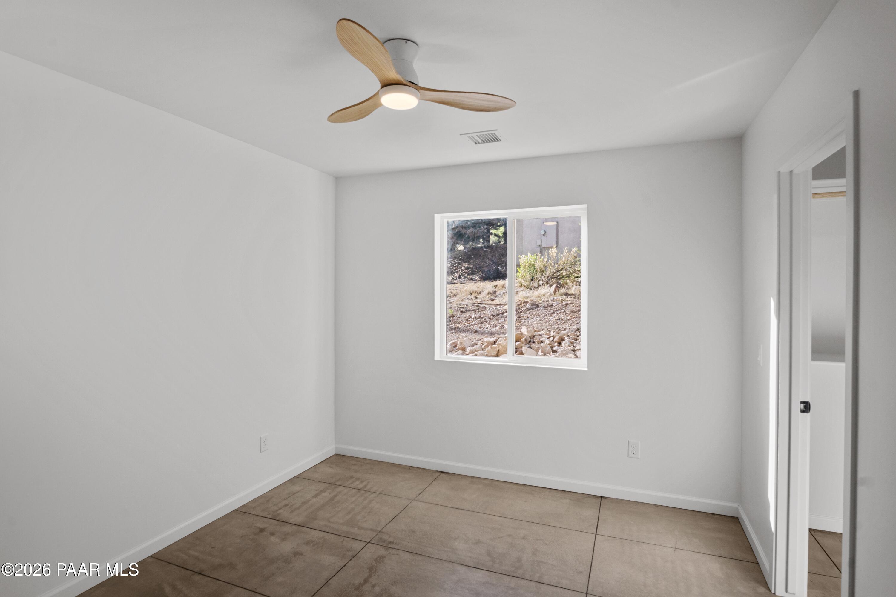 4920 East Amber Road Prescott, AZ 86301 - Photo 27 of 38 an empty room with a window