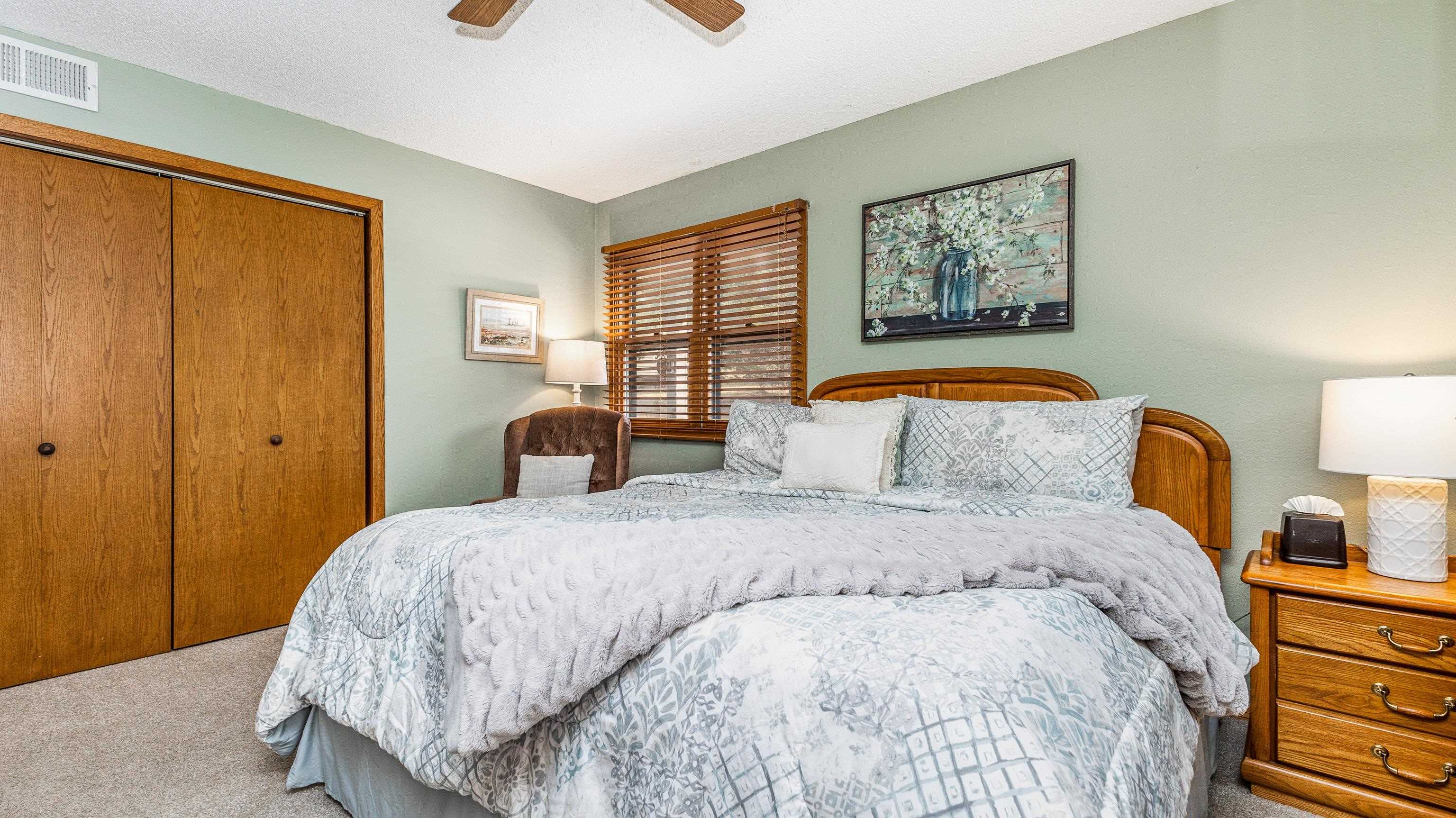 7 Colony Lane Galena, IL 61036 - Photo 13 of 36 a bedroom with a bed and wooden floor