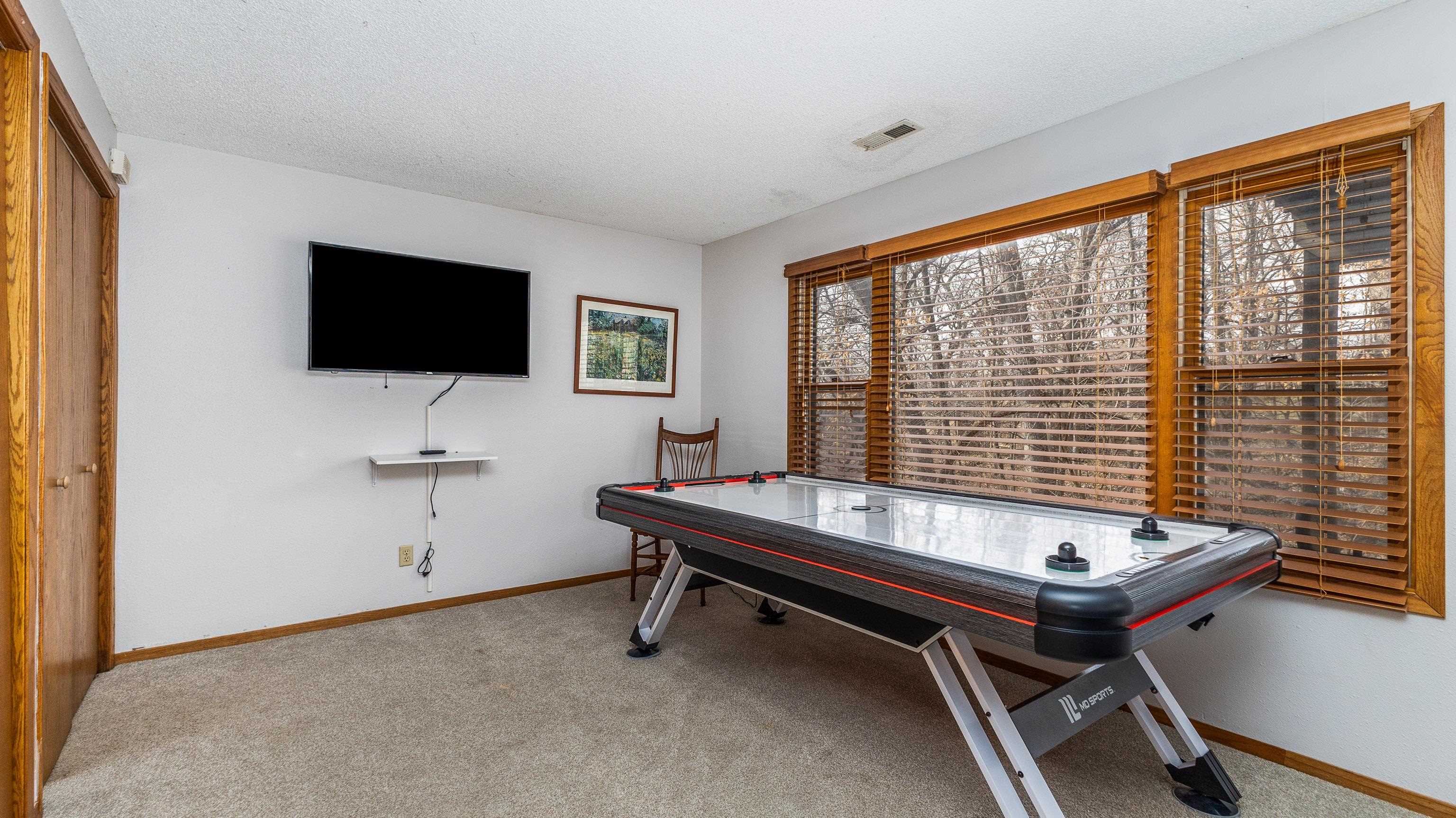 7 Colony Lane Galena, IL 61036 - Photo 21 of 36 a living room with a flat screen tv and a large window