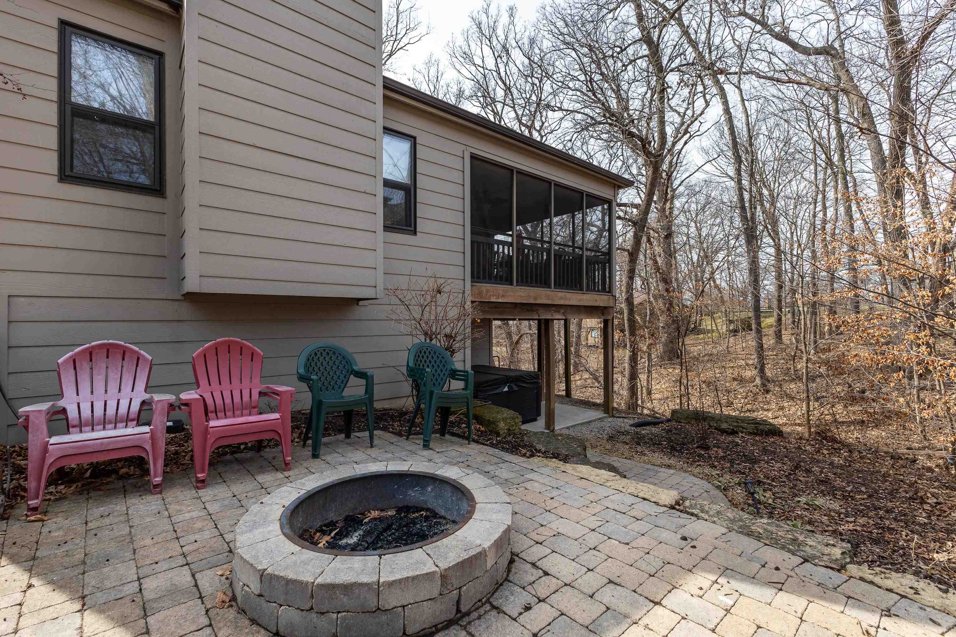 7 Colony Lane Galena, IL 61036 - Photo 36 of 36 a front view of a house with barbeque garden and outdoor seating