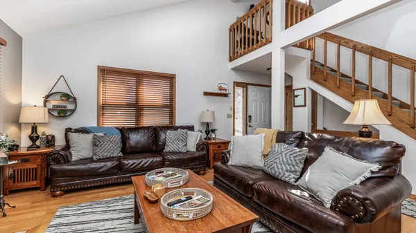 a bedroom with two beds and a window
