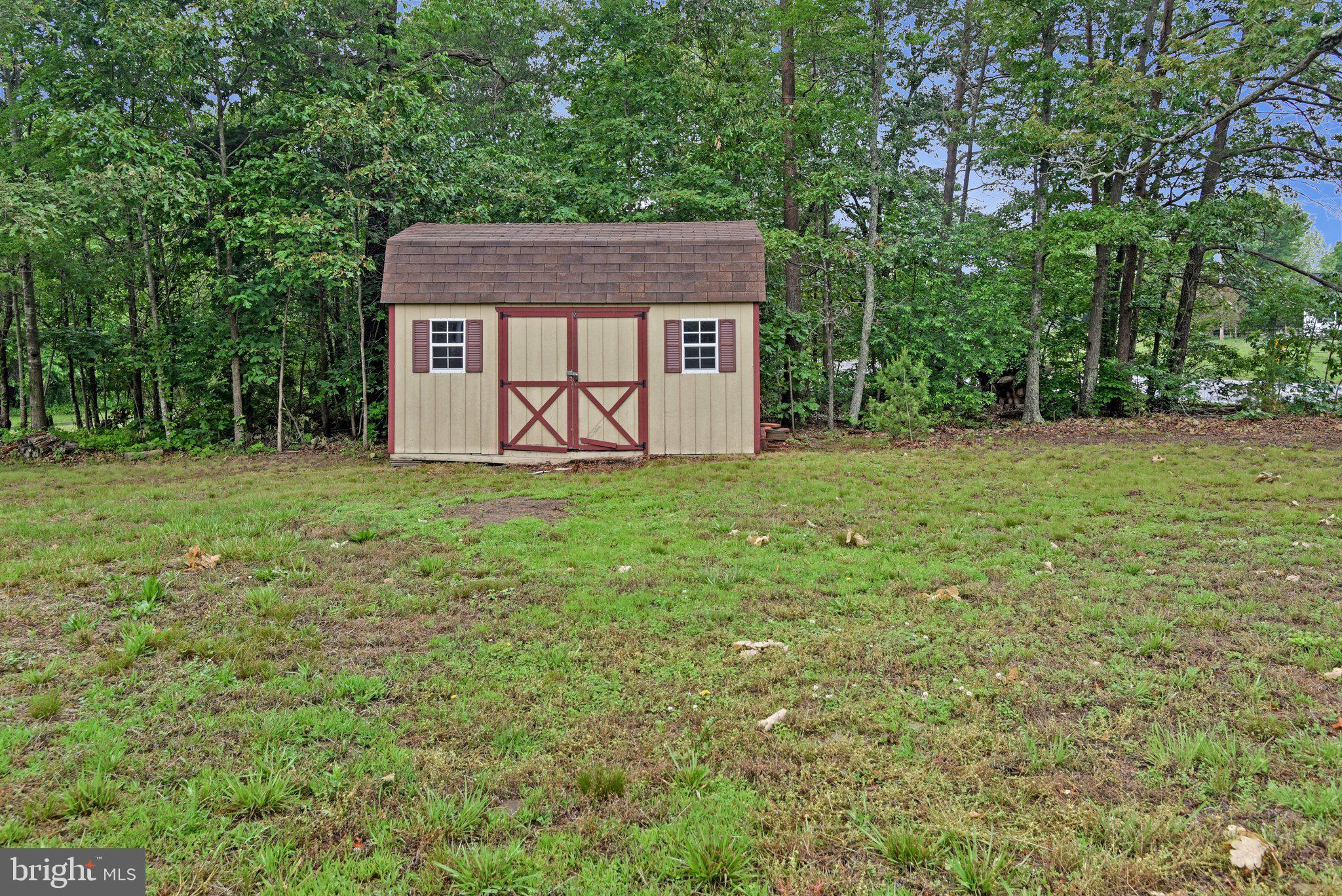8965 Poorhouse Road Port Tobacco, MD 20677 - Photo 13 of 18 a view of a house with a yard
