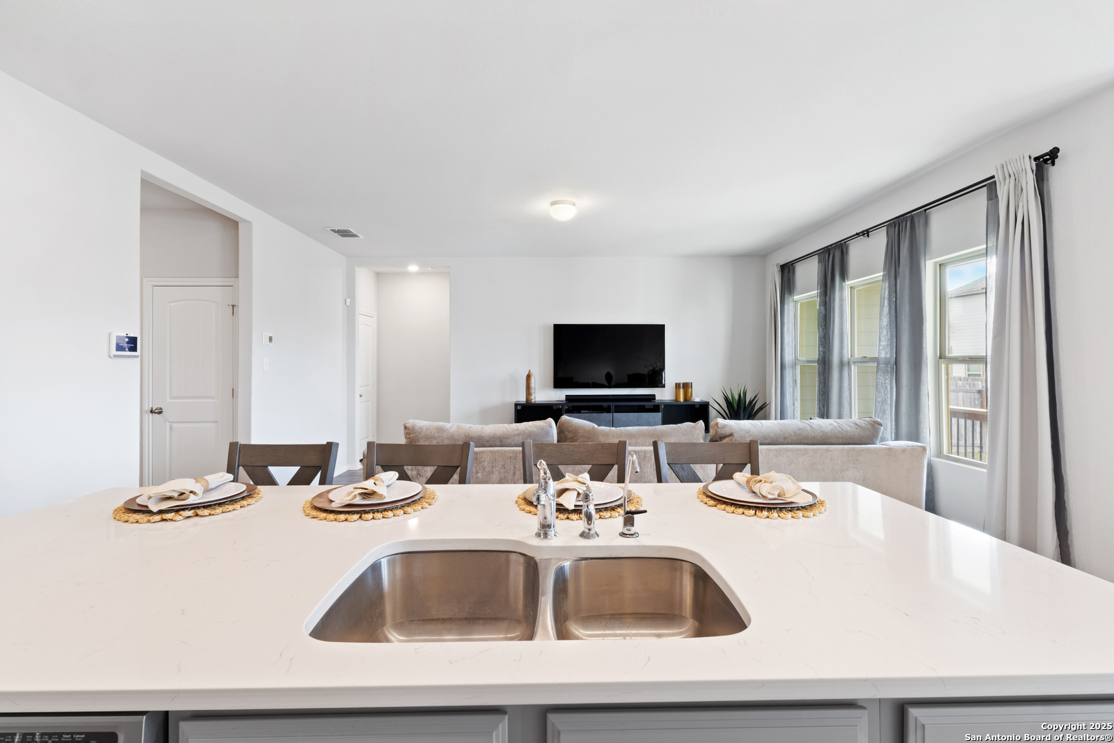 6847 Alaskan Wy. Converse, TX 78109 - Photo 12 of 32 a kitchen with a sink and a large window