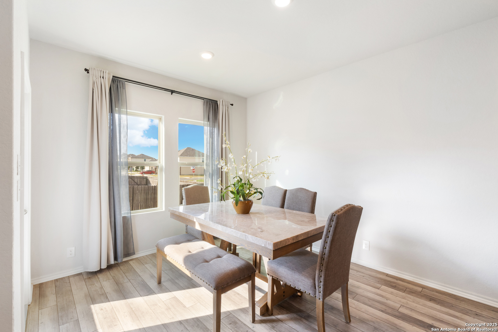 6847 Alaskan Wy. Converse, TX 78109 - Photo 14 of 32 a view of a dining room with furniture window and wooden floor