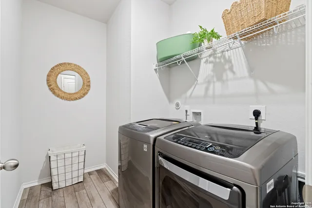 a utility room with dryer and washer