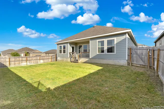 a view of a house with swimming pool yard and outdoor seating