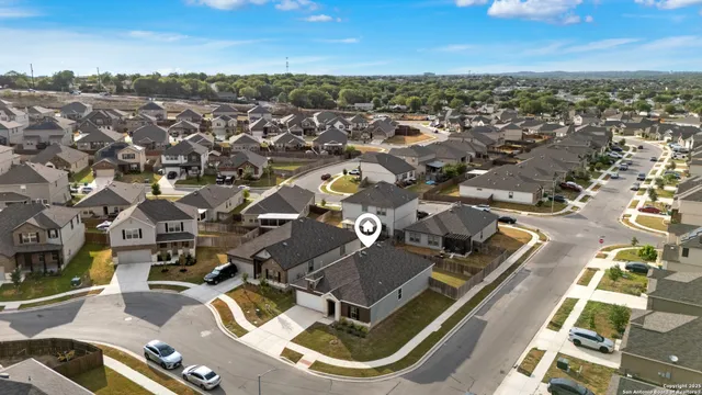an aerial view of residential houses with outdoor space