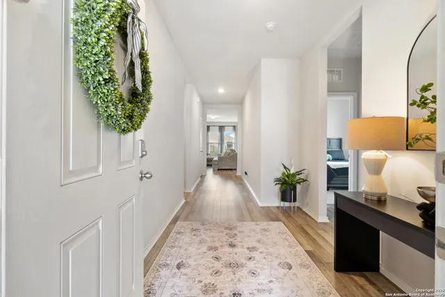 wooden floor with a potted plant in a room