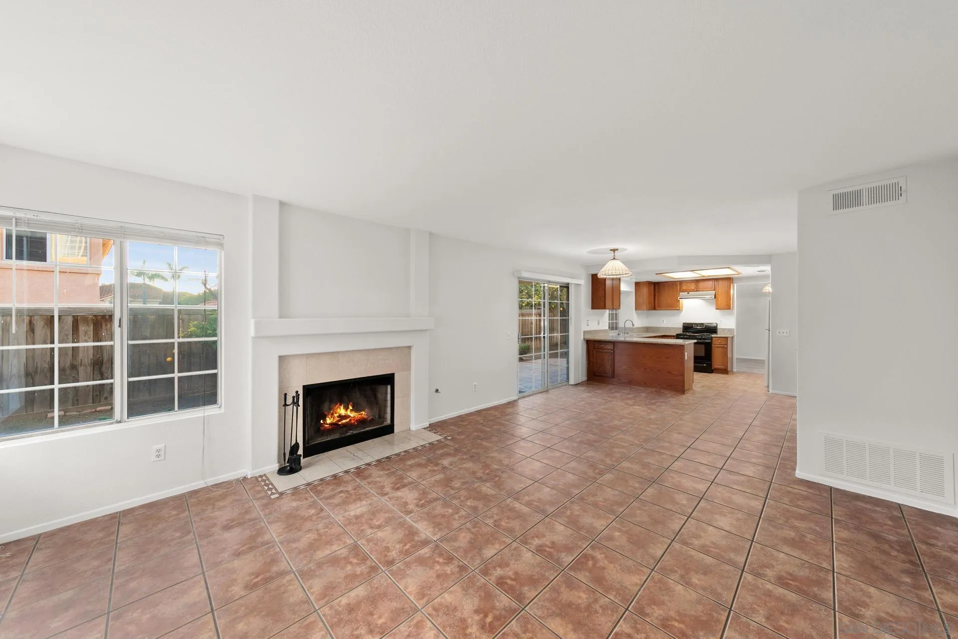403 Calle Corazon Oceanside, CA 92057 - Photo 12 of 40 a view of a livingroom with a fireplace and window