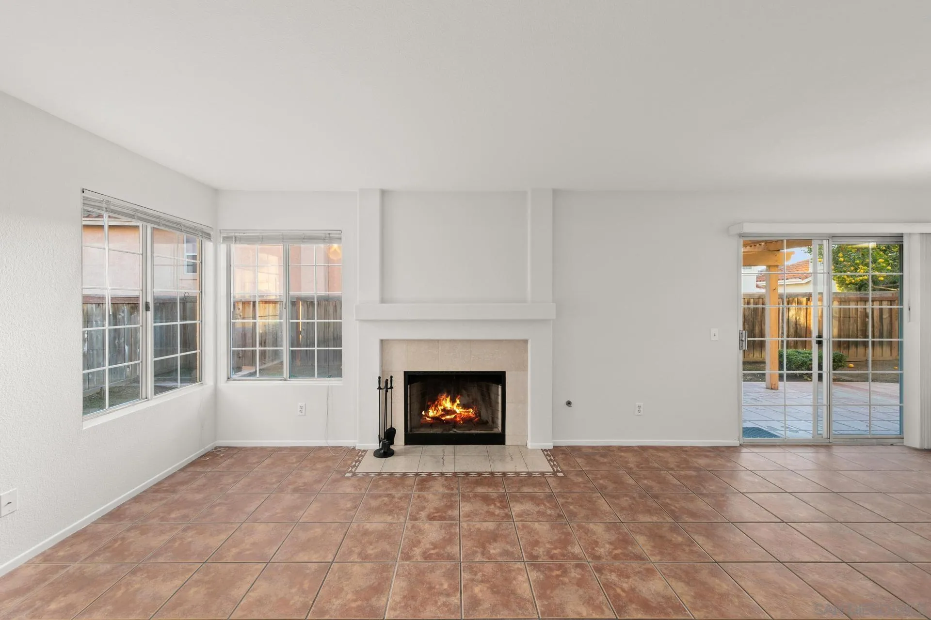 403 Calle Corazon Oceanside, CA 92057 - Photo 13 of 40 a view of an empty room with a fireplace