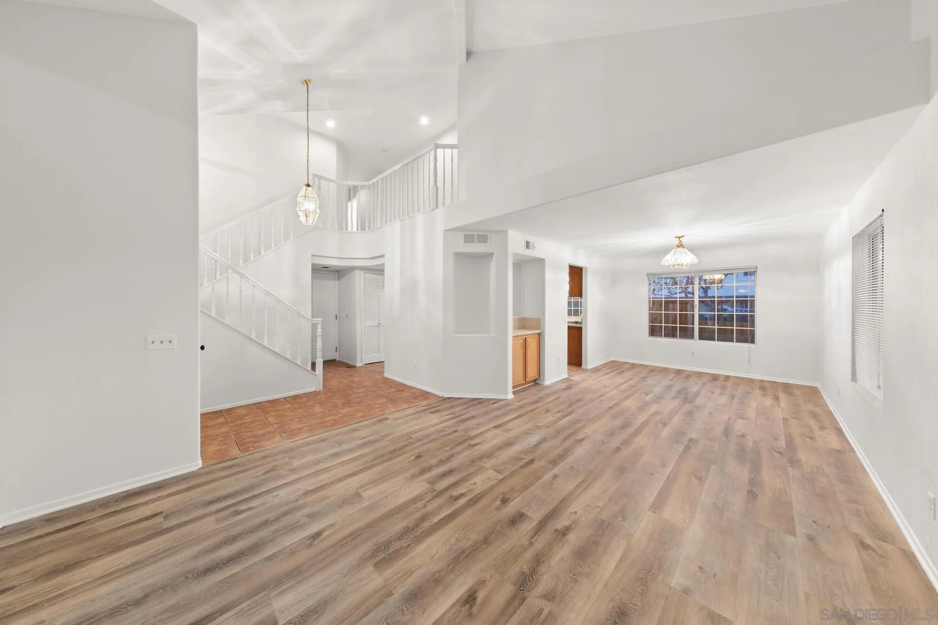 403 Calle Corazon Oceanside, CA 92057 - Photo 17 of 40 a view of an empty room with wooden floor