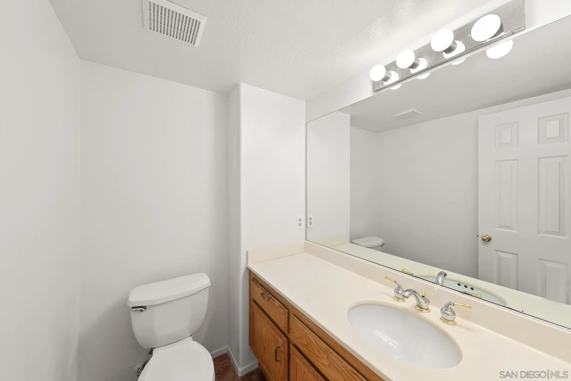 403 Calle Corazon Oceanside, CA 92057 - Photo 18 of 40 a bathroom with a sink vanity granite and toilet