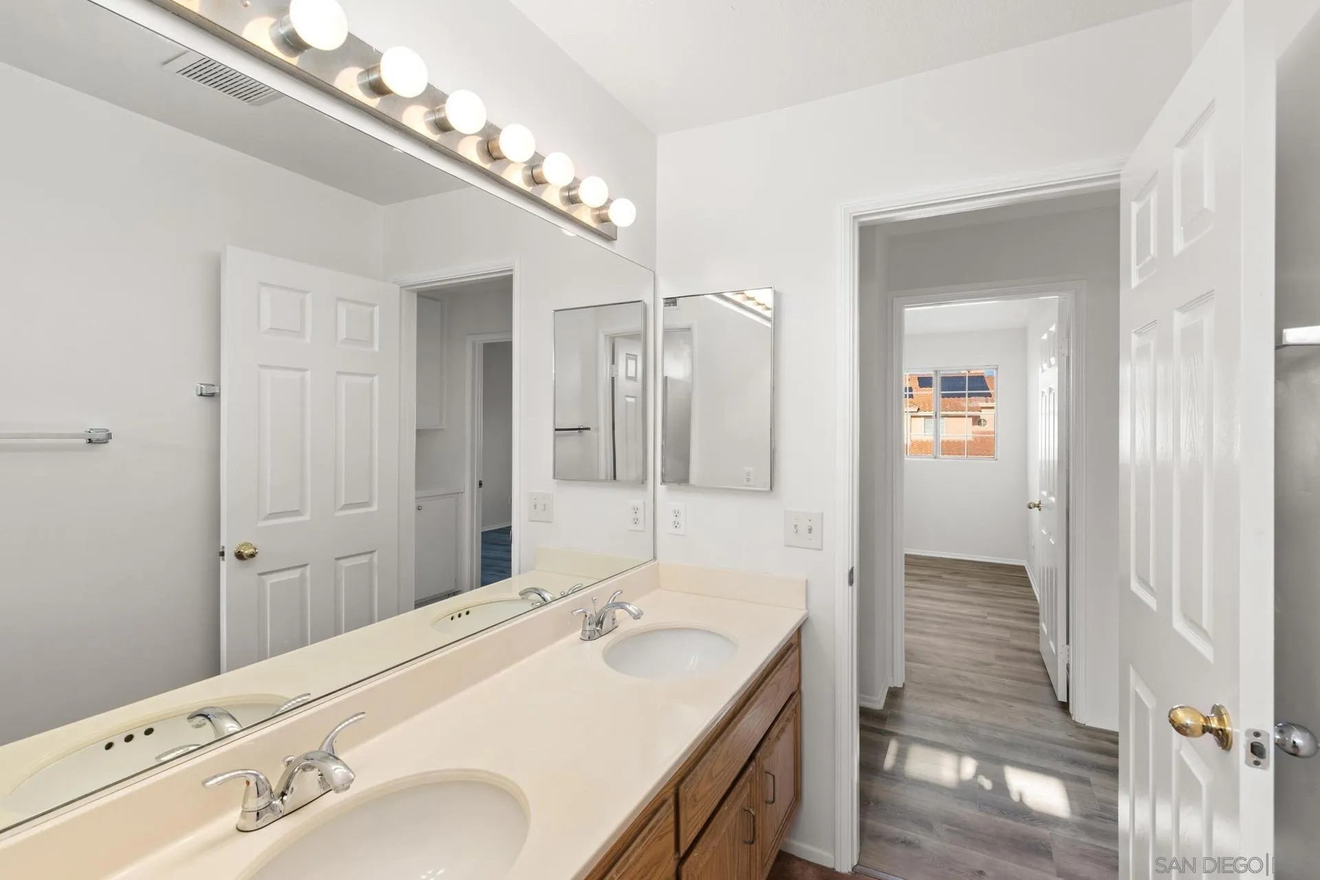 403 Calle Corazon Oceanside, CA 92057 - Photo 21 of 40 a bathroom with a sink and a mirror