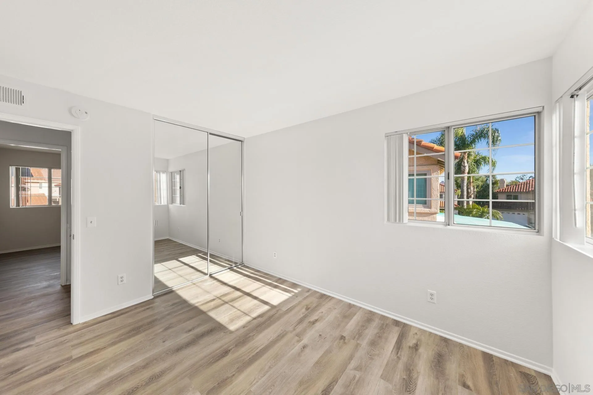 403 Calle Corazon Oceanside, CA 92057 - Photo 24 of 40 a view of wooden floor and windows in a room