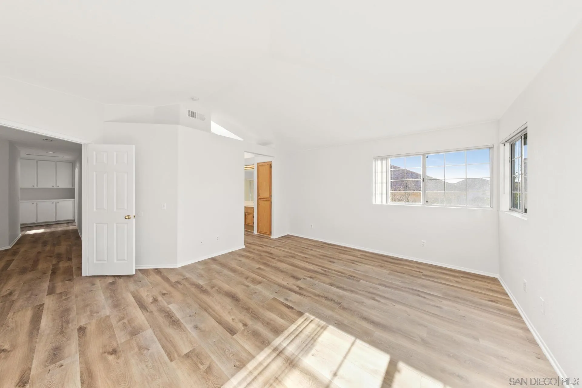 403 Calle Corazon Oceanside, CA 92057 - Photo 28 of 40 a view of empty room with wooden floor