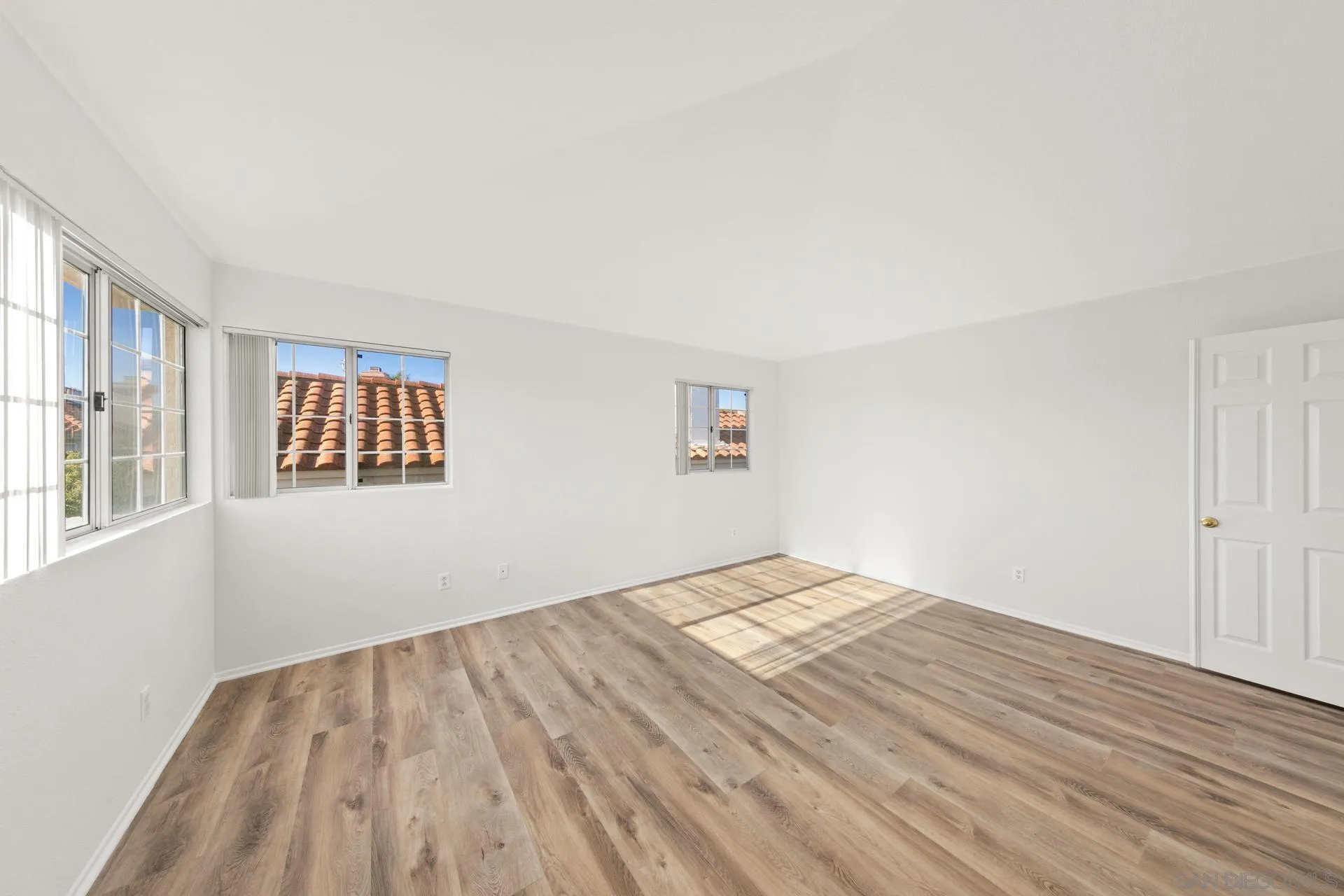 403 Calle Corazon Oceanside, CA 92057 - Photo 30 of 40 a view of empty room with wooden floor and fan