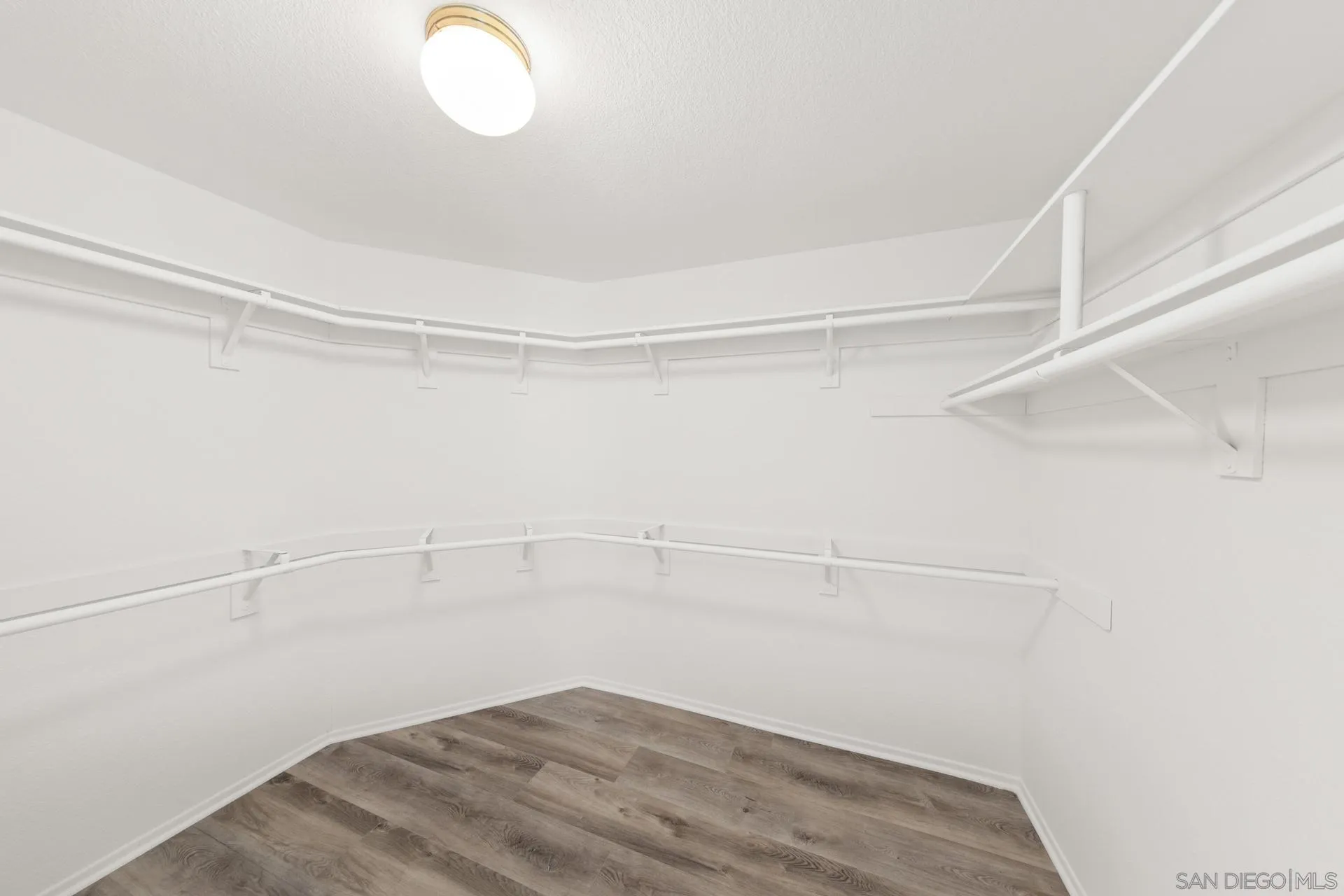 403 Calle Corazon Oceanside, CA 92057 - Photo 31 of 40 a view of a room with racks on the wall